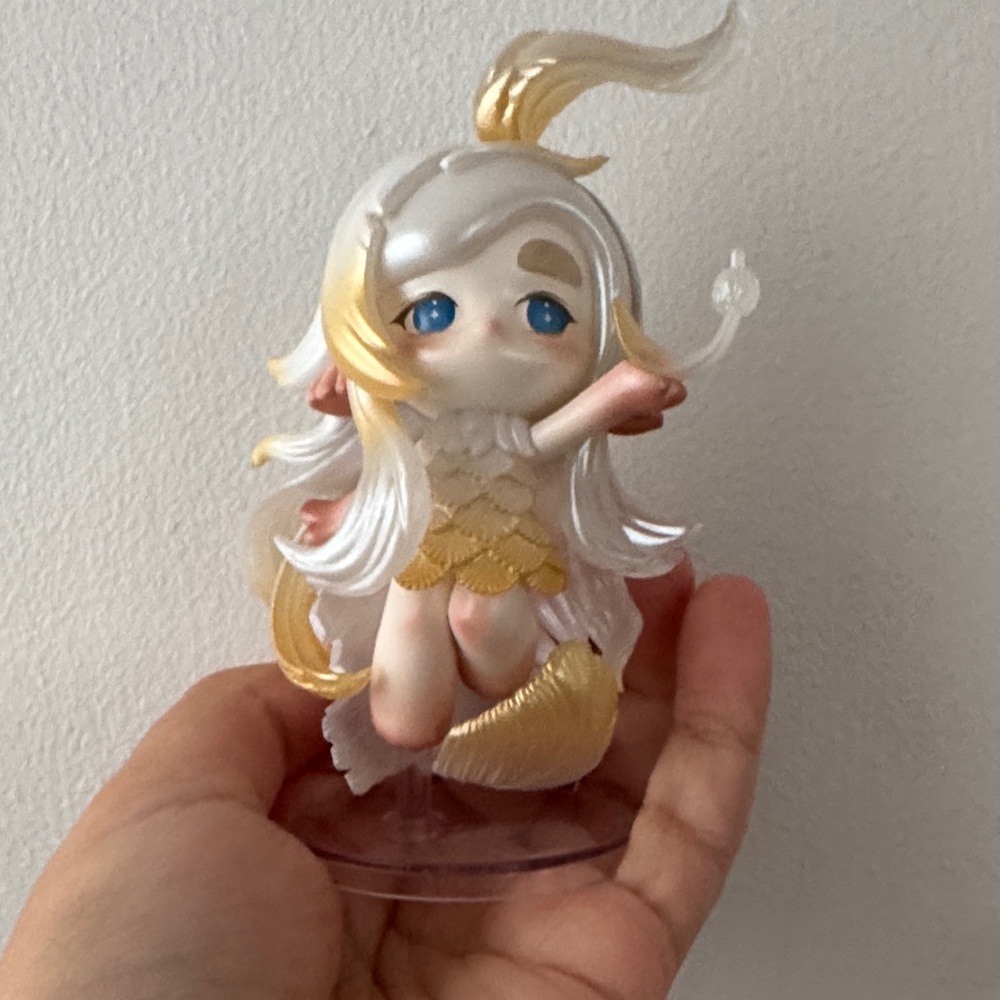 Gold and White Figurine